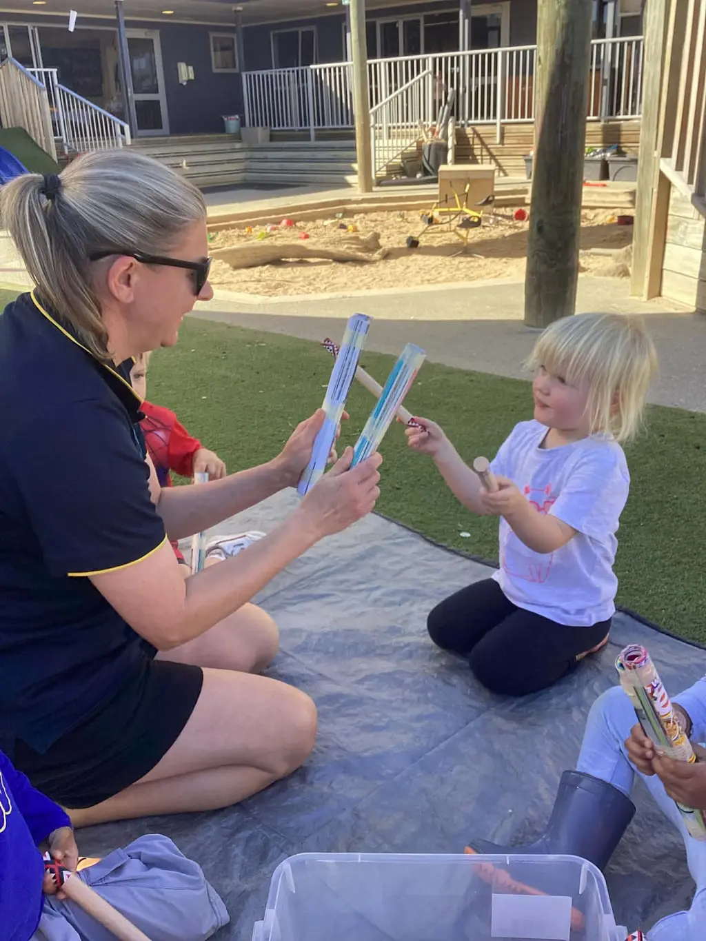 Kaiako sharing a playful one-to-one moment with a child at Highfield Haven