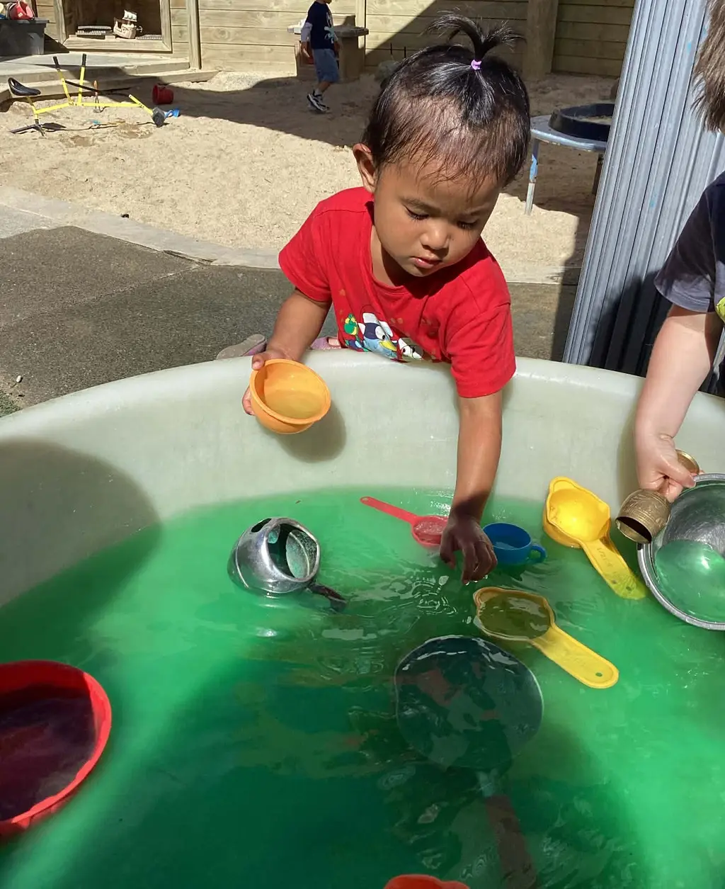 Children engaged in water play at Highfield Haven